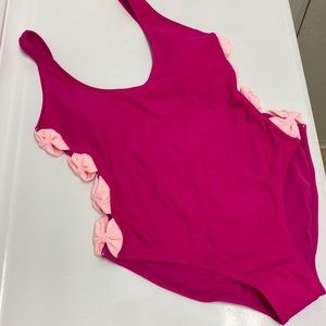 Magenta women’s one piece swimsuit with bow details